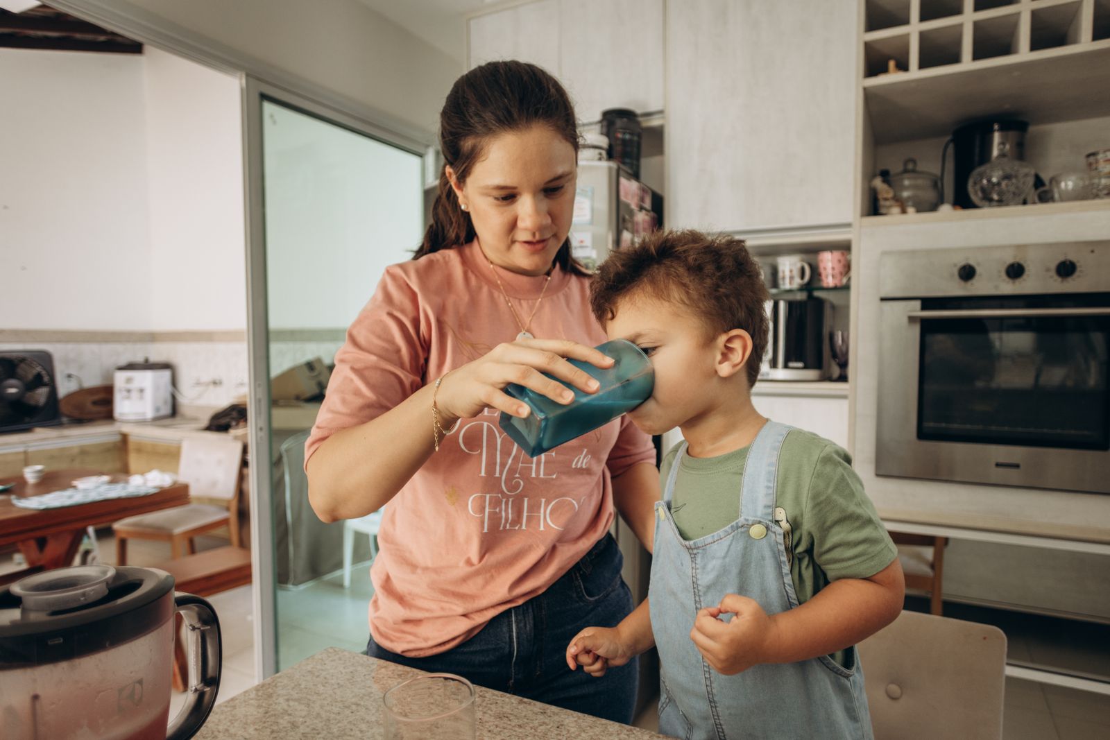 Family enjoying drinking water together at home